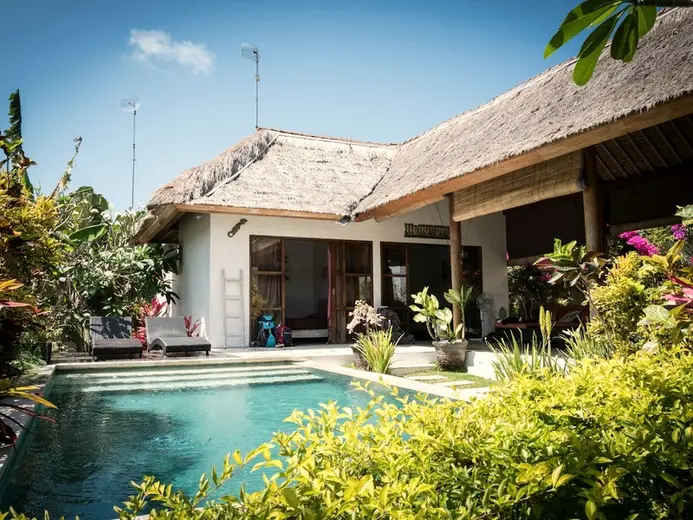 A guesthouse with a small pool.